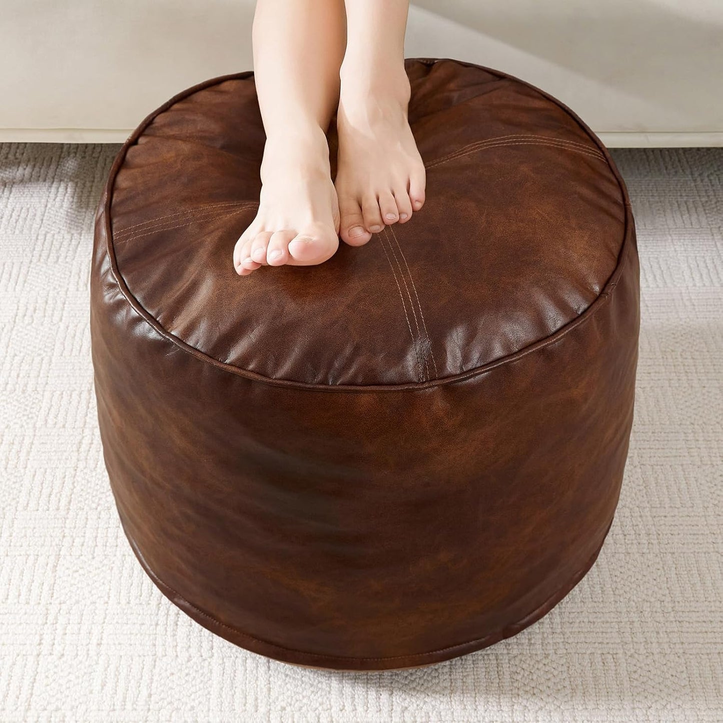 HIGOGOGO Round Stuffed Pouf Ottoman, Pu Leather Poufs with Foam Chunk Filling, Furry and Fluffy Pouf Foot Stool Storage Ottoman, 26 X 18 Floor Poufs Foot Rest for Living Room,Dark Brown